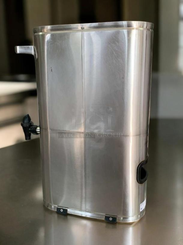 Curtis TLXA2201G iced tea dispenser in excellent condition, stainless steel, tested and working, features spigot and handles.