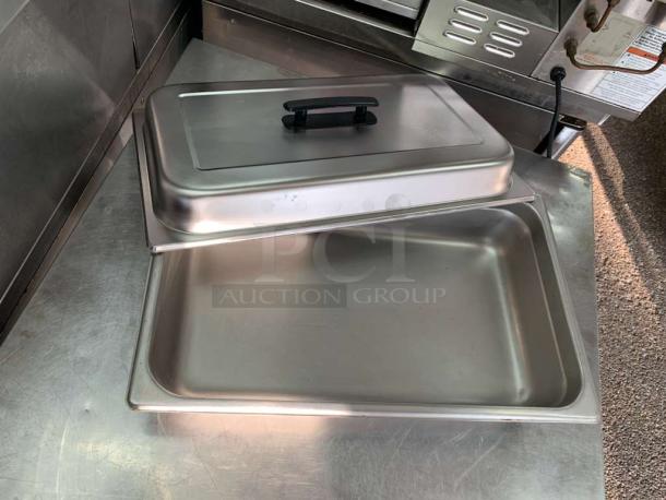 Vollrath 30042 stainless steel steam table pan cover in excellent condition, full-size, tested, and clean with handle.