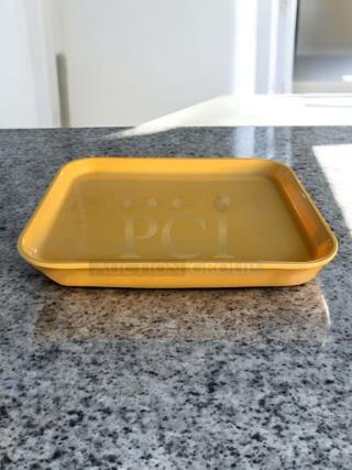 Tan Cambro Camtray 1520 rectangular cafeteria tray in excellent condition, clean and tested, on a countertop.