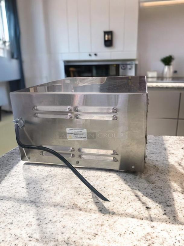 Henny Penny HCS-123 heated holding cabinet in excellent condition, stainless steel, tested and working, on granite countertop.