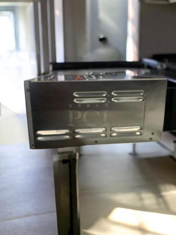 Henny Penny HCS-123 heated holding cabinet in excellent condition, stainless steel, tested and working, side view.