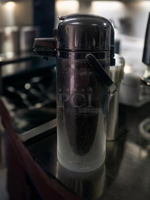 BUNN Airpot Coffee Server, black, push-top dispenser, excellent condition, tested and working, stainless steel exterior.