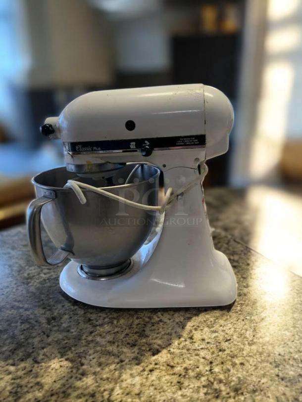 KitchenAid Classic Series 4.5-Qt Tilt-Head Stand Mixer, model K45SSWH, in excellent condition, white color on countertop.