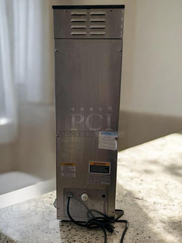 Stainless steel BUNN Dual BrewWISE DBC coffee brewer, excellent condition, tested and working, visible warning labels.