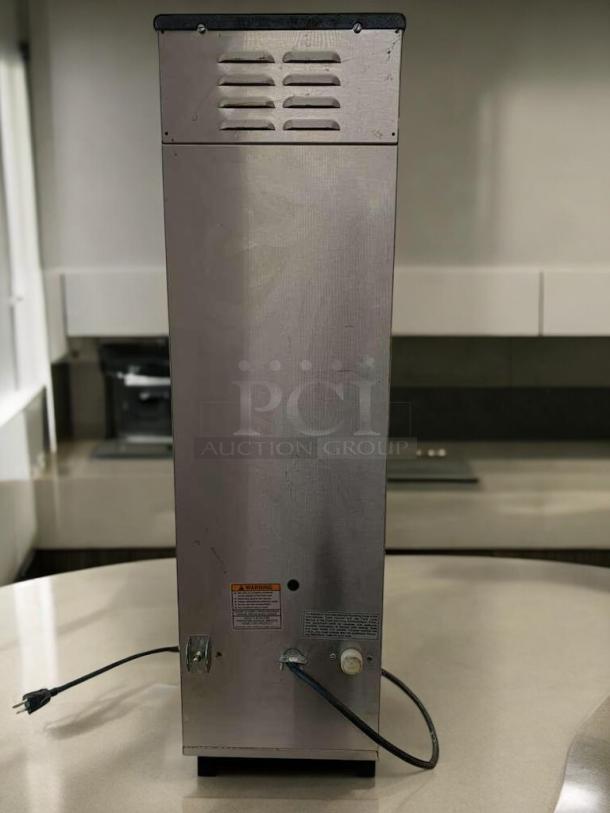 BUNN Dual BrewWISE DBC coffee brewer, stainless steel, excellent condition, tested and working, visible warning labels.
