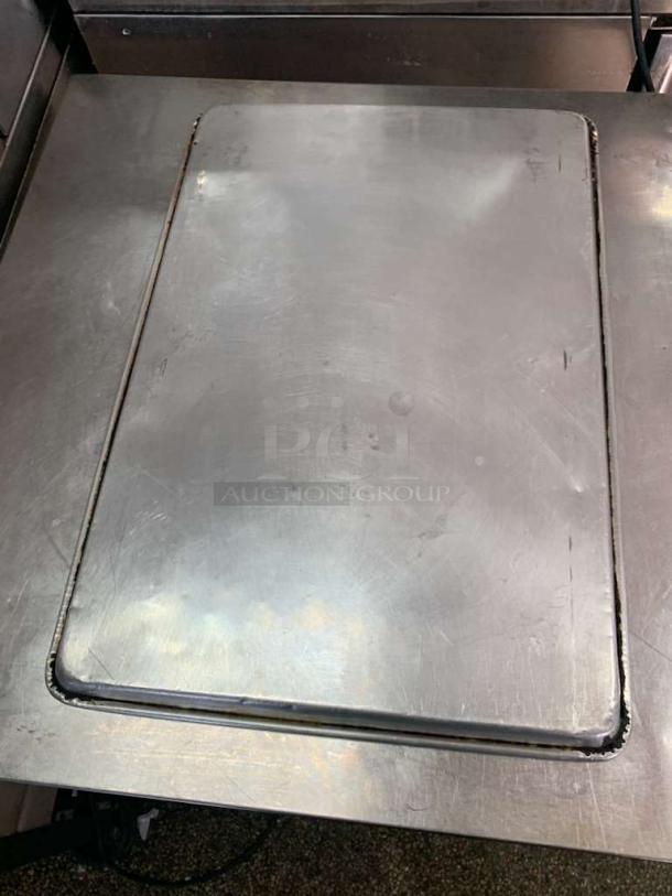 Universal Commercial Grade full-size stainless steel sheet pan, commercial bake tray, slight wear, durable build.