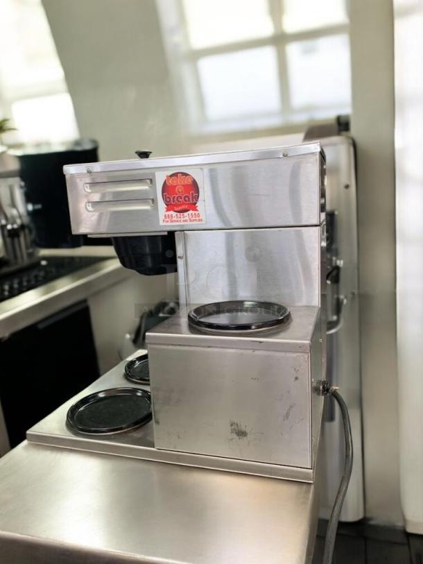 Stainless steel Curtis D60GT coffee brewer with single warmer, excellent condition, tested and working. "Take a Break" sticker visible.