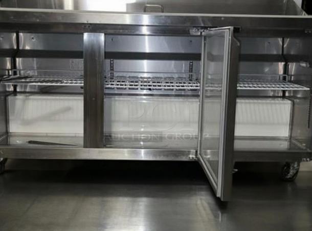 Immaculate MoTak MST-72-X 70" refrigerated sandwich/salad prep table, open door, shelves visible, 115V, fully tested.