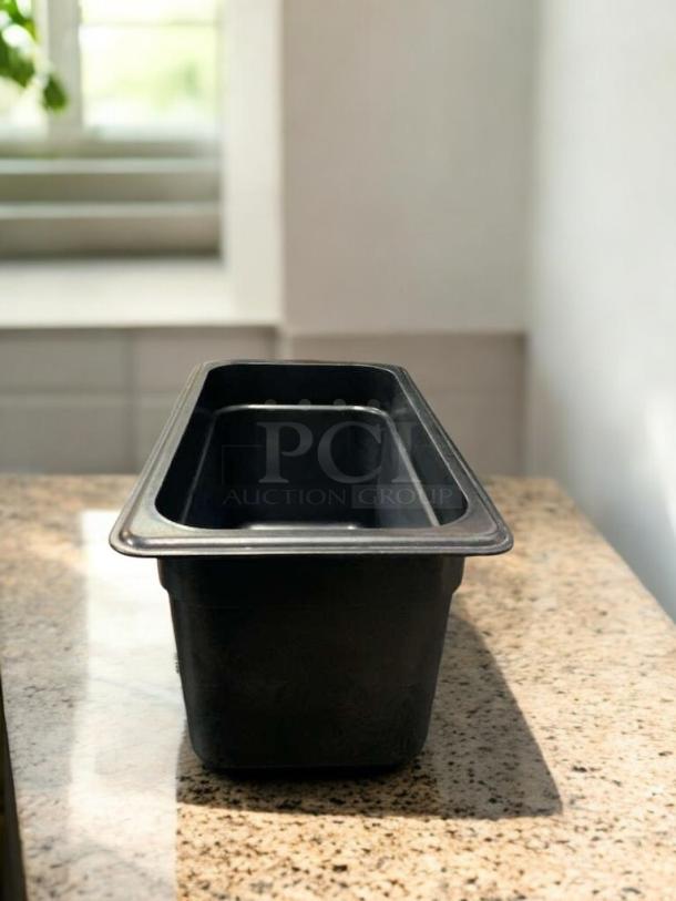 Black 1/9 size polycarbonate food pan, 4" deep, Cambro/Carlisle compatible, NSF certified, excellent condition.
