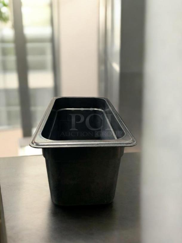 Black 1/9 size food storage container, 4" deep, Cambro/Carlisle, excellent condition, NSF polycarbonate, tested and cleaned.