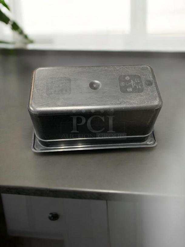 Black Cambro/Carlisle food storage container, 1/9 size, 4" deep, polycarbonate, excellent condition, NSF certified.