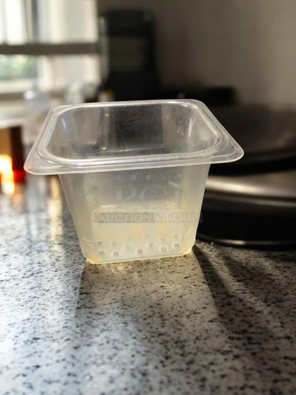 Clear 1/6 size food storage container, 6" deep, NSF polycarbonate, in excellent condition, compatible with Cambro/Carlisle.
