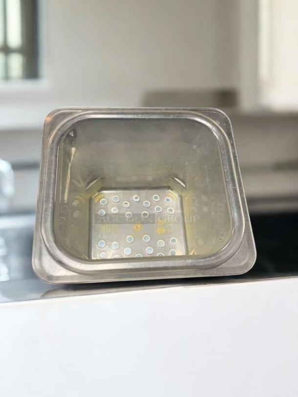 Clear 1/6 size polycarbonate food storage pan, 6" deep, NSF-approved, excellent condition, commercial-grade, clean.