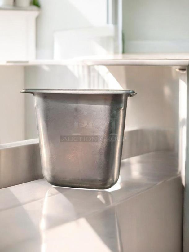 Stainless steel food pan, 1/6 size, 6" deep, NSF certified. Excellent condition, tested, cleaned, commercial grade compatible.