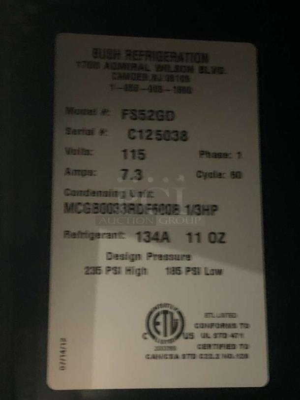 Label on Bush Refrigeration FS52GD fridge, listing Camden, NJ, model, voltage, amps, and refrigerant details.
