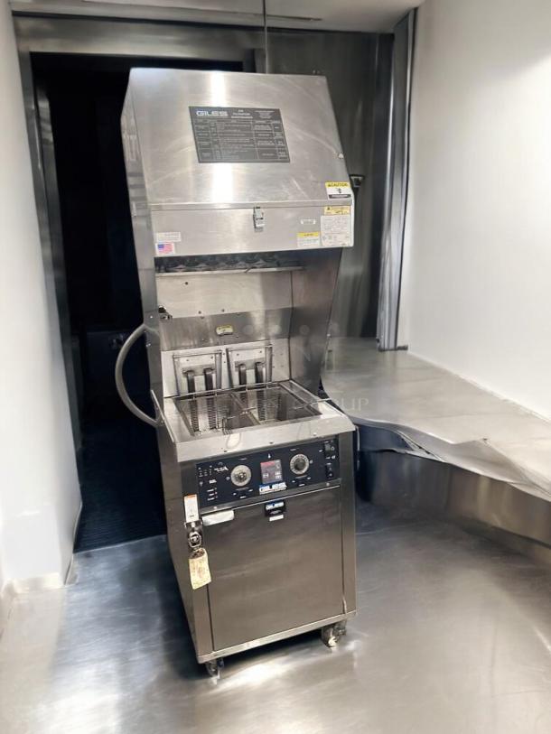 Immaculate Giles WOG-MP-VH ventless electric fryer with built-in hood, 208V. Fully tested, excellent condition, metal finish.