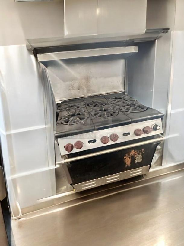 Imperial IR-6 6-Burner Gas Range with Oven in great condition; natural gas; fully tested and working; visible wear on surface.