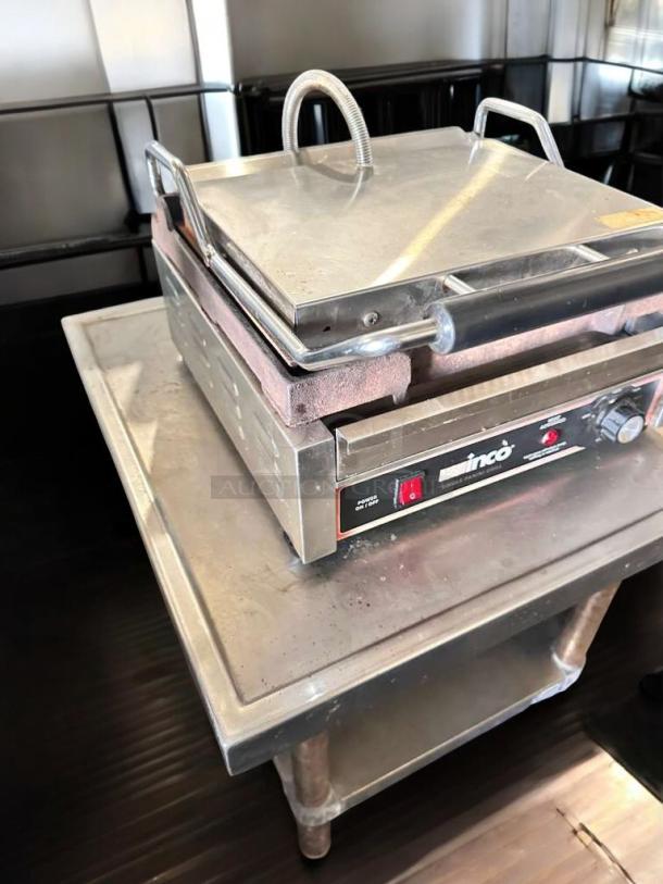 INCO EPG-1C single panini grill in superb condition on countertop. Features stainless steel, power switch, and brand label, 120V.