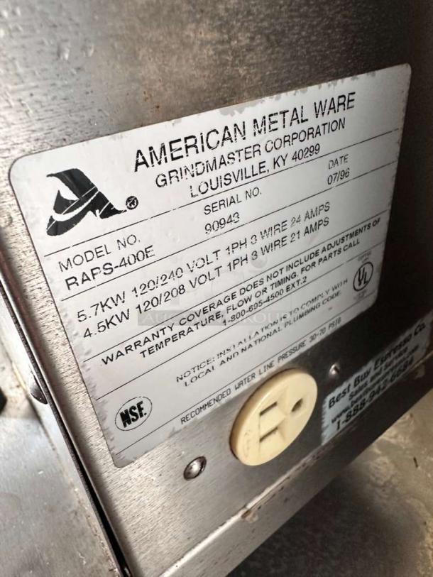 Close-up of a label on the Mazzer Robur Electronic Coffee Grinder, listing manufacturer details and specifications.