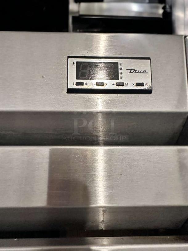 True GDM-43EM two-door commercial display refrigerator with control panel and logo; pristine condition, fully tested.
