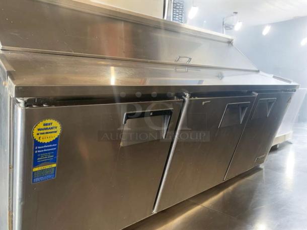 Everest EPBNR3 3-door refrigerated sandwich prep table in superb condition, stainless steel, 115V. Warranty sticker visible.