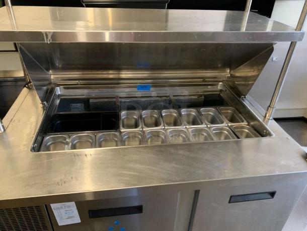 Delfield 4448NP refrigerated sandwich prep table in outstanding condition, fully tested, stainless steel, with ingredient bins.