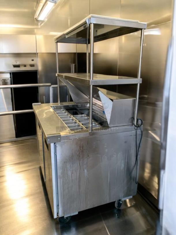 Delfield 4448NP refrigerated sandwich prep table, stainless steel, outstanding condition, on casters, 115V, fully tested.