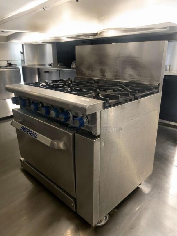 Imperial IR-6 gas range, 6 burners, standard oven, natural gas, excellent condition, fully tested, stainless steel finish.