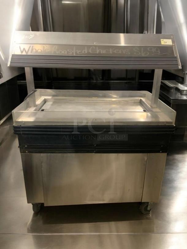 BK MM-4 Cold Food Merchandiser, outstanding condition, stainless steel, fully tested, 120V. Sign displays "Whole Roasted Chickens $6.99".