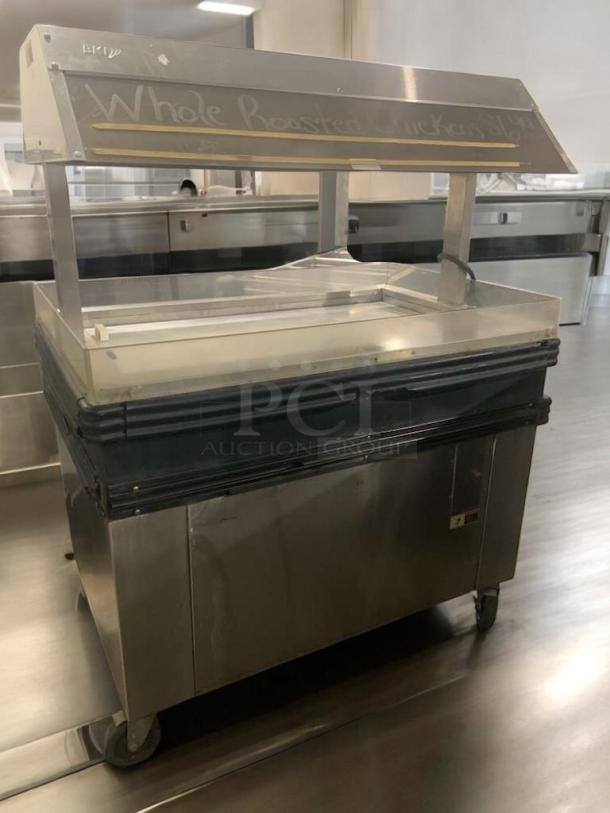 BK MM-4 Cold Food Merchandiser, stainless steel, excellent condition, 120V, fully tested, glass sneeze guard, on wheels.