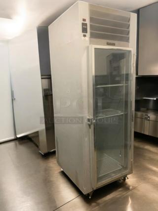 Traulsen G11010 single glass door reach-in refrigerator, pristine condition, fully tested, 115V, visible vent and shelving.