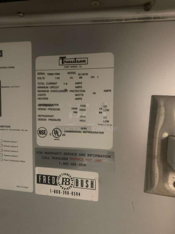 Traulsen G11010 label showing model, serial number, electrical specifications, and UL/NSF certifications.
