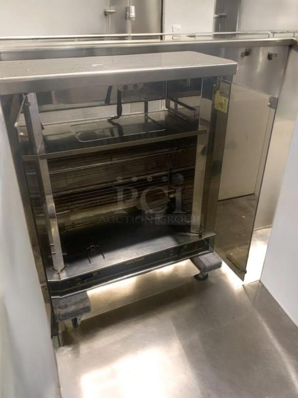Pristine electric chicken rotisserie, 2-spit countertop model, fully tested and working, stainless steel finish, excellent condition.