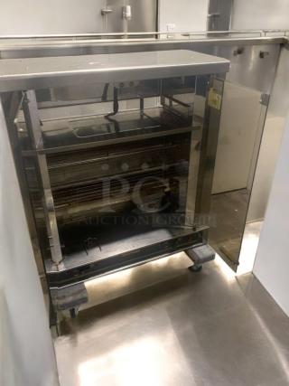 Pristine electric chicken rotisserie, 2-spit countertop model, fully tested and working, stainless steel finish, excellent condition.