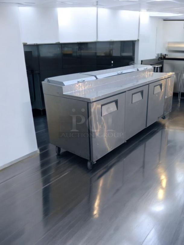 True TPP-93 Refrigerated Pizza Prep Table, pristine condition, 115V, stainless steel, fully tested, on casters.