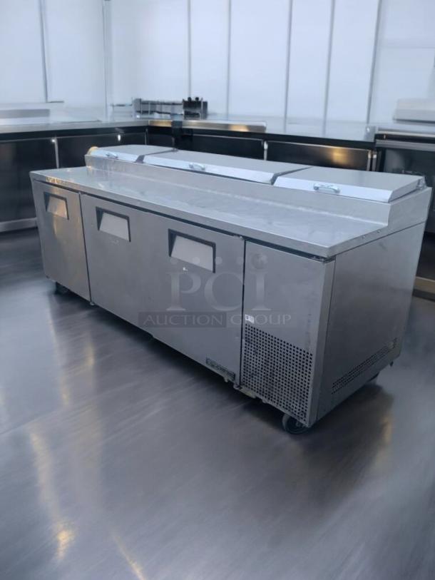 Pristine True TPP-93 refrigerated pizza prep table, stainless steel, 115V, fully tested, excellent condition, with storage doors.