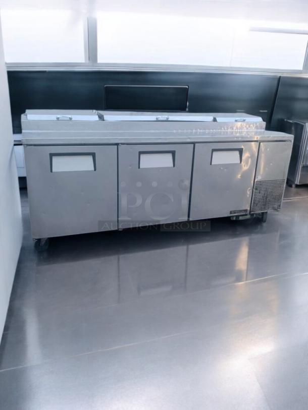 Pristine True TPP-93 refrigerated pizza prep table, stainless steel, three-door, 115V, fully tested, excellent condition.