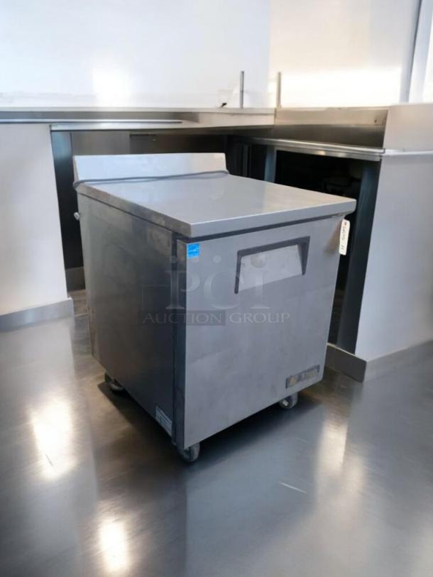 Pristine True TWT-27F under-counter freezer, 27", stainless steel, 115V, fully tested, excellent condition, on casters.