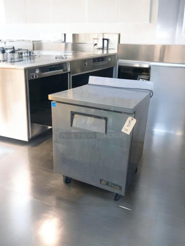 Pristine True TWT-27F under-counter freezer, 27", 115V, stainless steel, fully tested, True Manufacturing label visible.