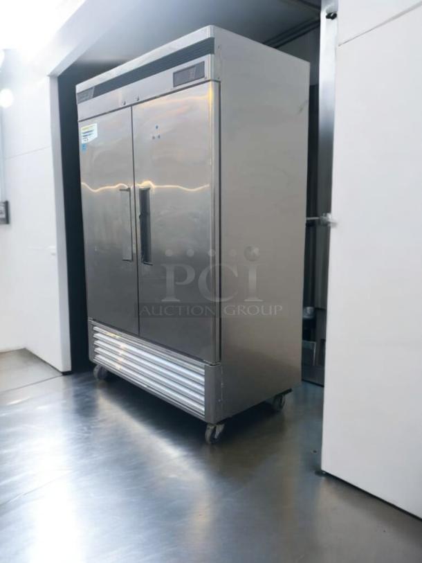 Turbo Air TSF-49SD double door commercial freezer in pristine condition, fully tested, 115V, stainless steel exterior, on casters.