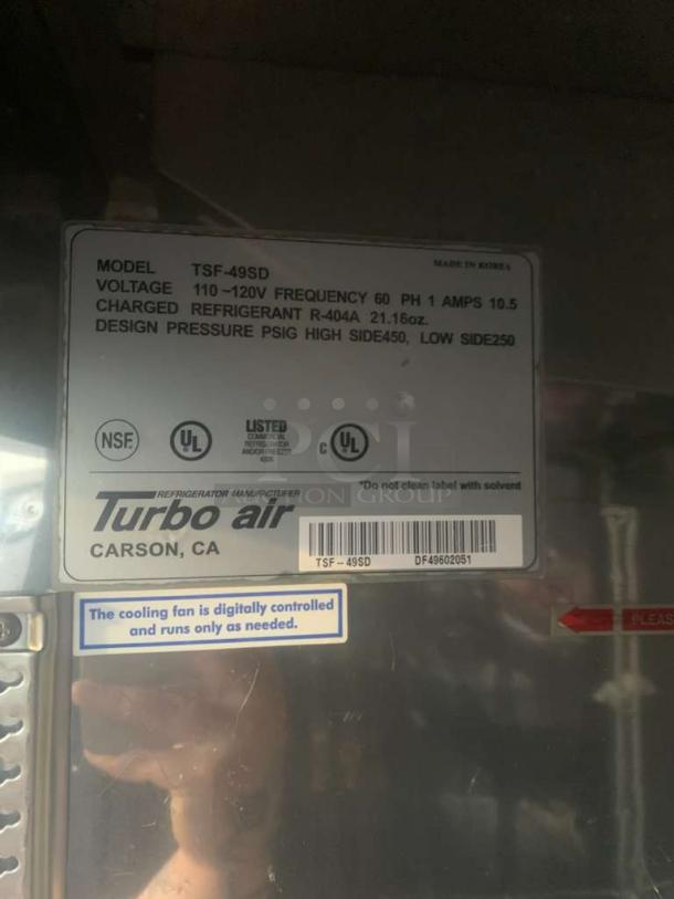 Turbo Air TSF-49SD commercial freezer label, 115V, pristine condition, tested. Includes model info and digital cooling fan note.