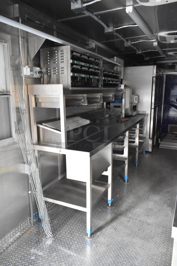 Brand new 2021 food trailer with CaptiveAire grease hood, 3 True freezers, True cooler, fry freezers, and sinks.