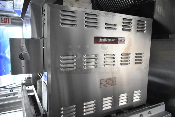 Interior view of a food trailer featuring a BroilVection oven, showcasing stainless steel finish and ventilation details.