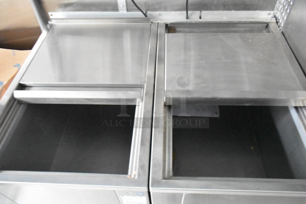 Brand new food trailer kitchen equipment including stainless steel freezers and storage bins, ideal for varied culinary concepts.