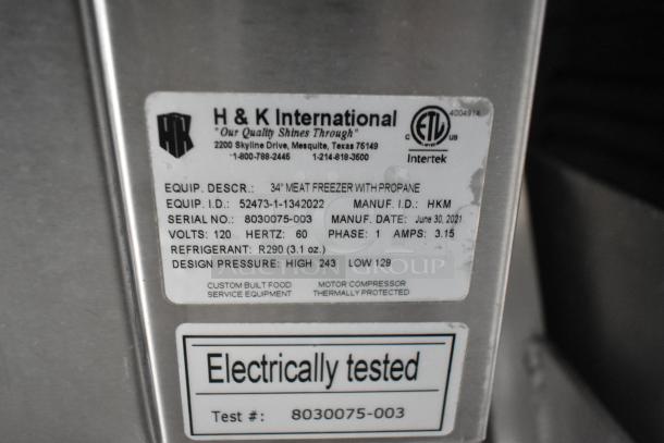 Label on H&K International 34" meat freezer indicating model details, propane use, manufacture date June 30, 2021, and testing info.