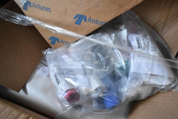 Box with Antunes logo containing labeled plastic bags with assorted equipment parts.