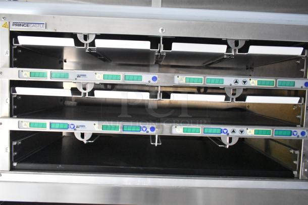 Prince Castle food holding bins in stainless steel. Each slot has control panels with buttons. Ideal for food trailer use.