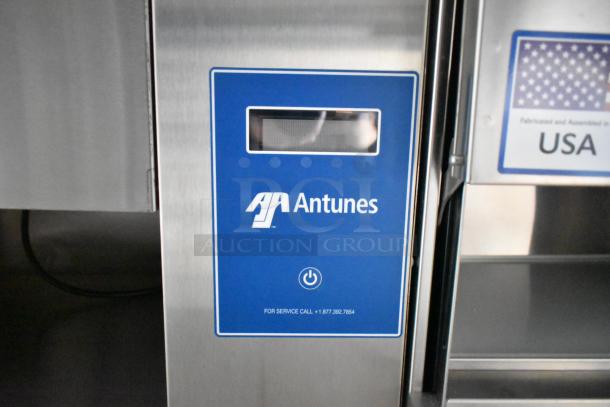Antunes control panel in a food trailer, featuring service contact info, part of a fully outfitted mobile kitchen.