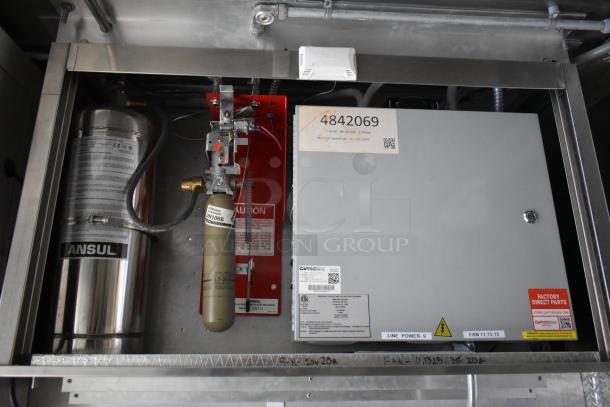 CaptiveAire grease hood system inside the food trailer, featuring Ansul fire suppression, labeled UN1066 and 4842069.