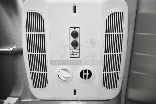 Coleman-Mach air conditioning unit in a fully equipped 2021 food trailer. Features vents and control knobs.